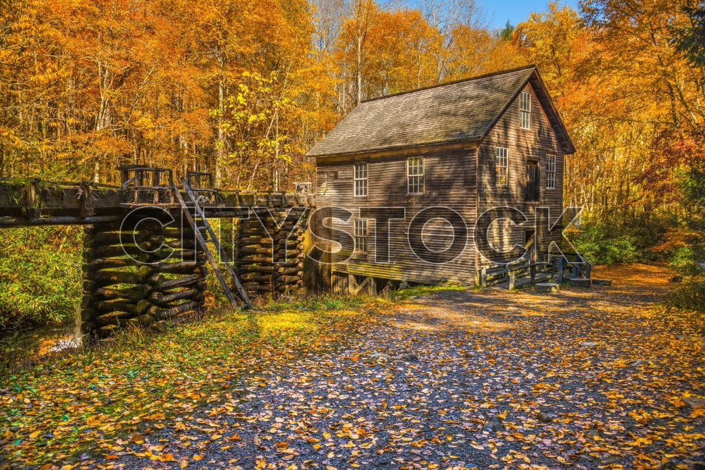 Historic wooden mill surrounded by autumn foliage in Maggie Valley, NC