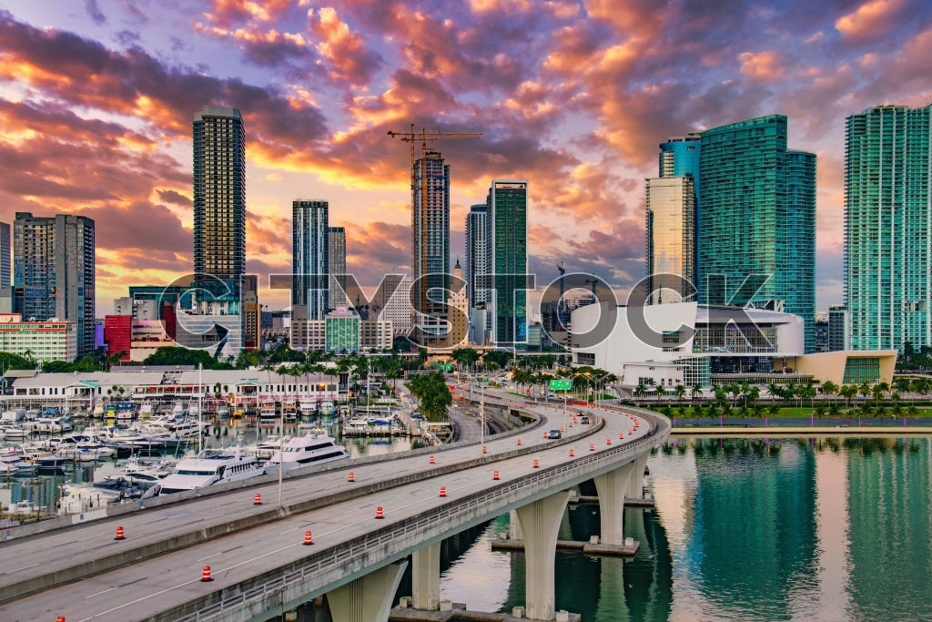 Sunset lighting up Miami skyline with marina view