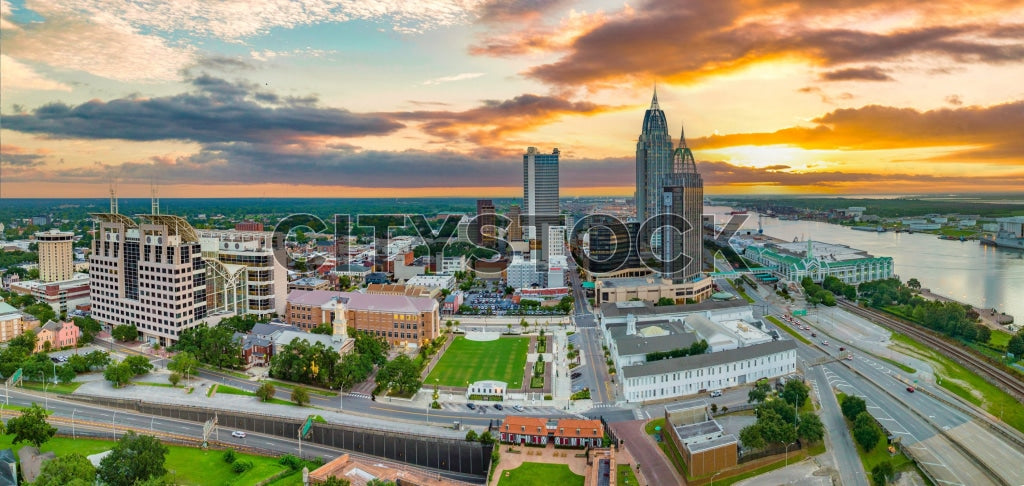 Aerial sunset view of Mobile, Alabama showing cityscape and river