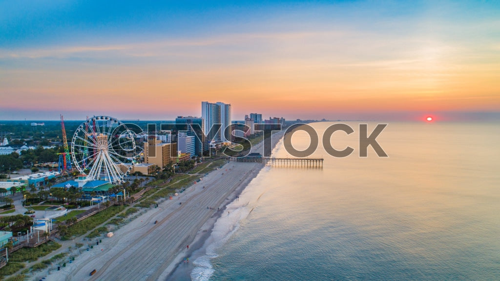 Aerial view of Myrtle Beach sunrise with skyline, Ferris wheel and pier