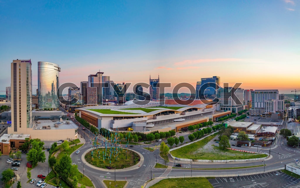 Aerial view of Nashville cityscape at sunrise with vibrant skies