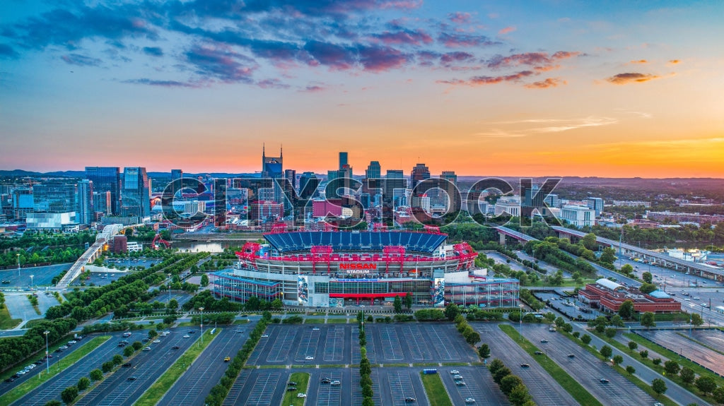 Aerial view of Nashville at sunrise with cityscape and stadium