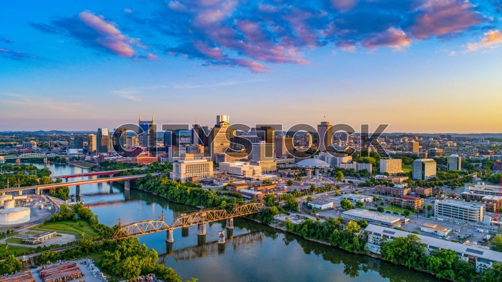 Aerial view of Nashville skyline during sunrise with vibrant hues