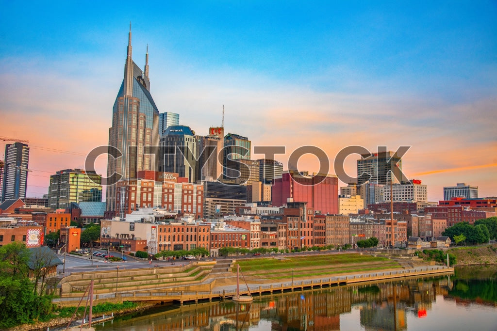 Dramatic sunset over Nashville skyline with Cumberland River