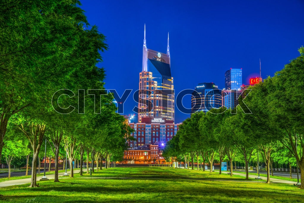Evening view of a green urban park with Nashville skyline in background