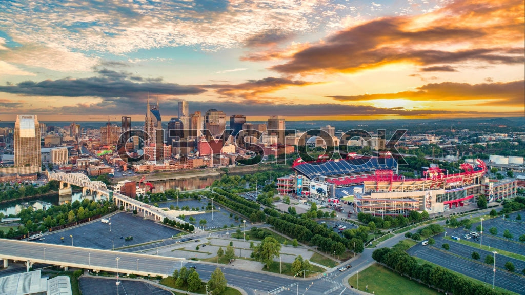 Aerial view of Nashville skyline and stadium at sunrise
