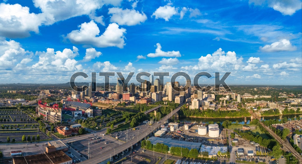 Aerial view of Nashville, Tennessee cityscape under a blue sky