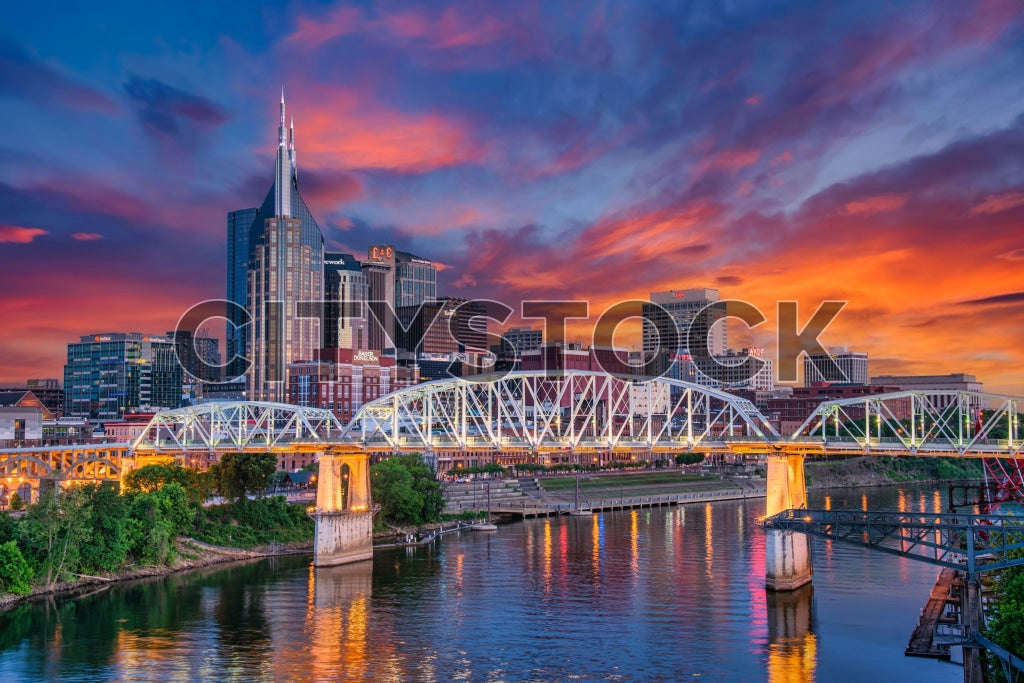 Nashville skyline and Cumberland River bridge at sunset