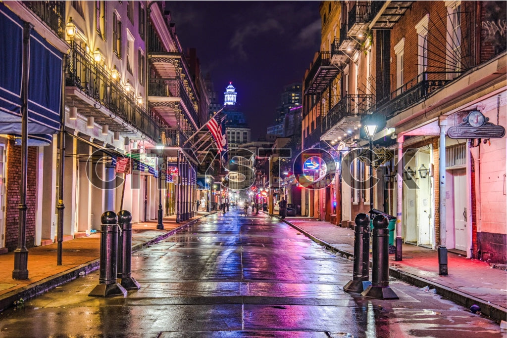 Rain-soaked street at twilight in historic New Orleans