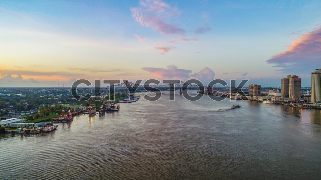 Aerial view of New Orleans skyline and Mississippi River at sunset