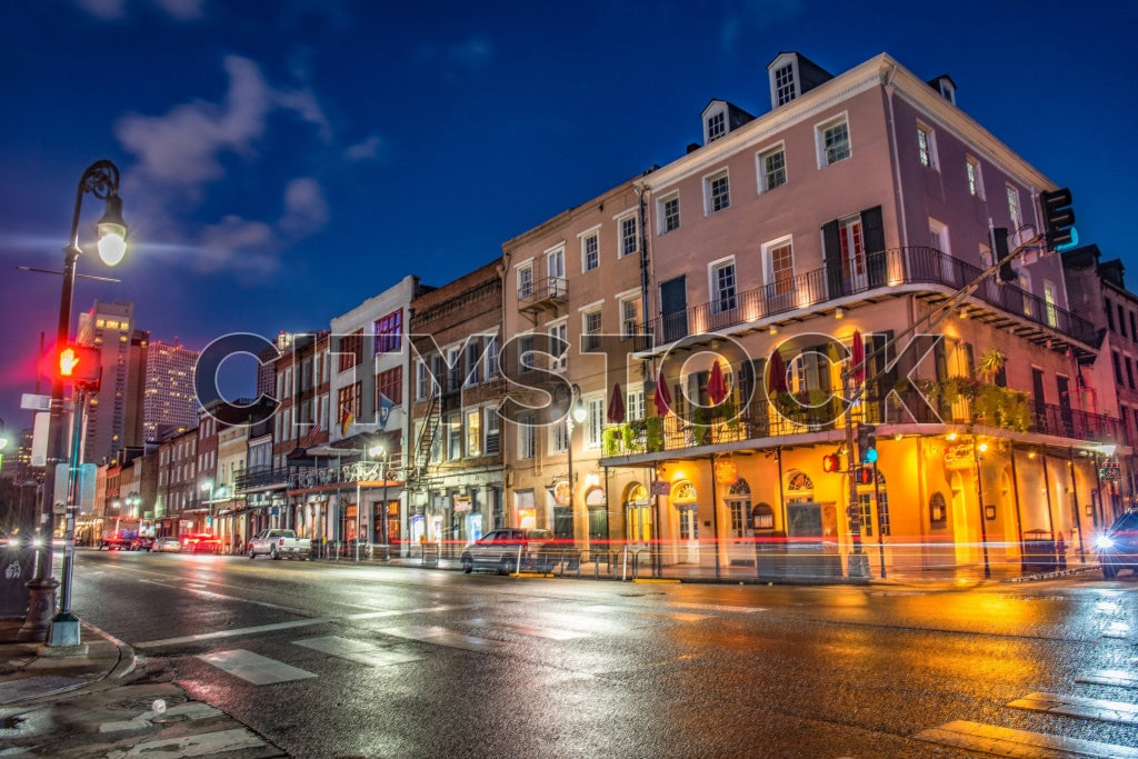 New Orleans cityscape with lively street and illuminated buildings at night