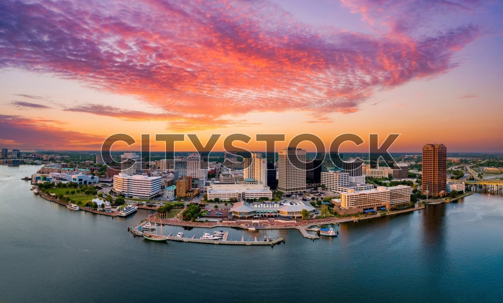 Aerial view of Norfolk, VA cityscape at sunrise with waterfront