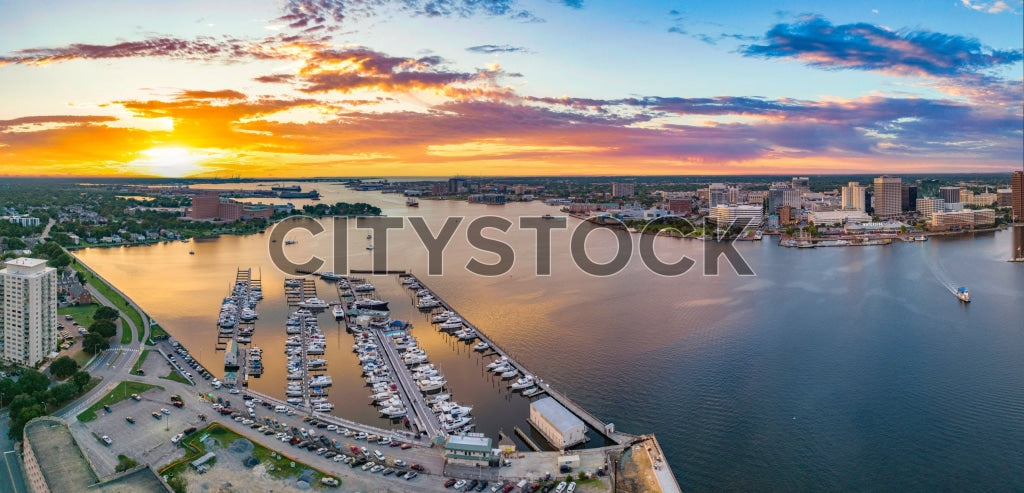 Aerial view of Norfolk harbor at sunset with boats and cityscape