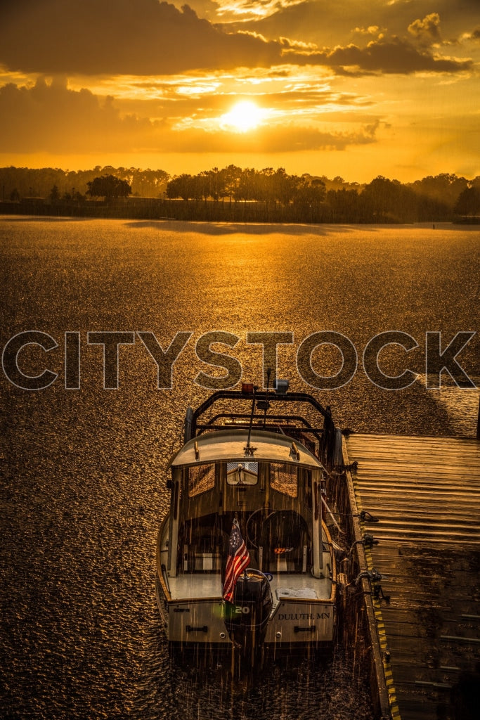 Golden sunset and vintage boat on a tranquil Orlando lake