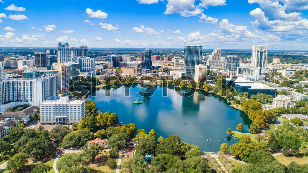 Aerial view of Orlando's skyline and Eola Lake, showcasing urban and natural beauty