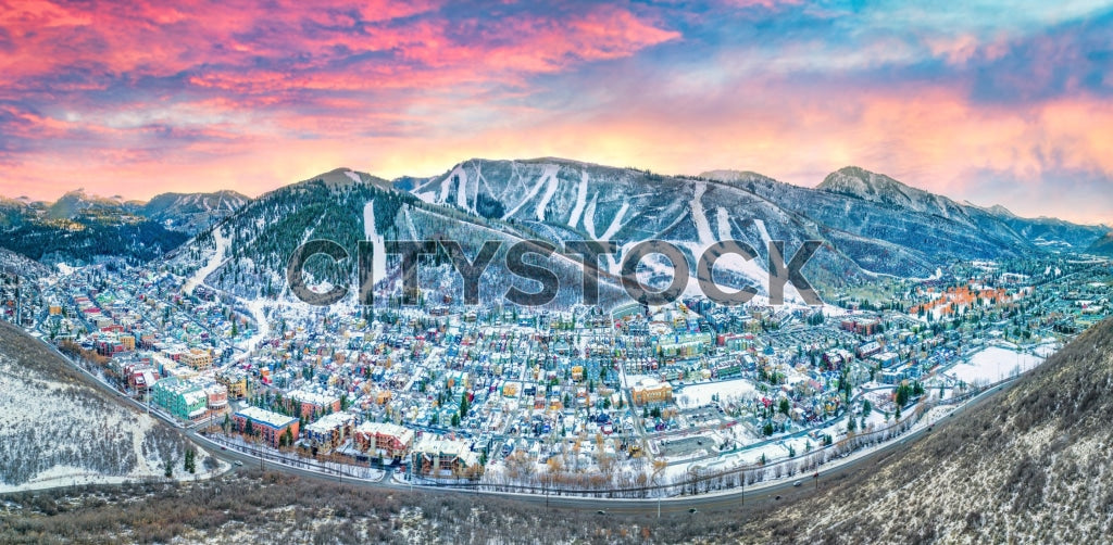 Aerial view of Park City, Utah at sunset with snowy mountains