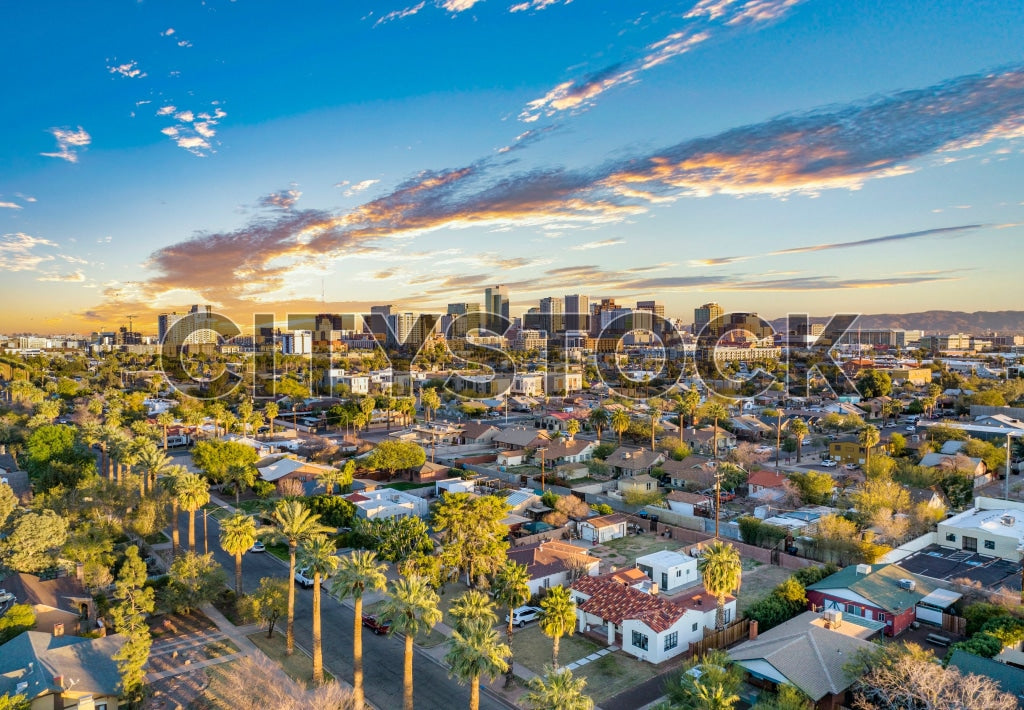 Aerial view of Phoenix, AZ with high-rise buildings and clouds