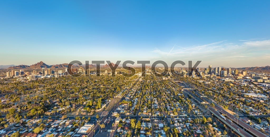 Aerial view of downtown Phoenix, Arizona under clear blue skies