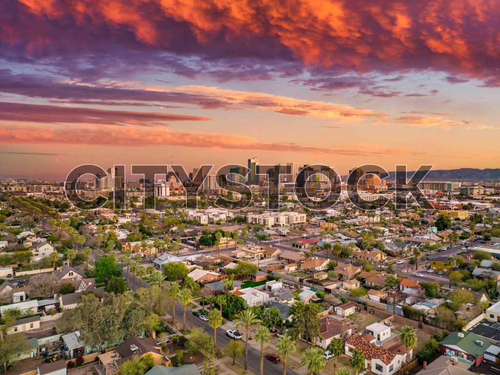 Sunset over Phoenix cityscape showing residential and commercial areas