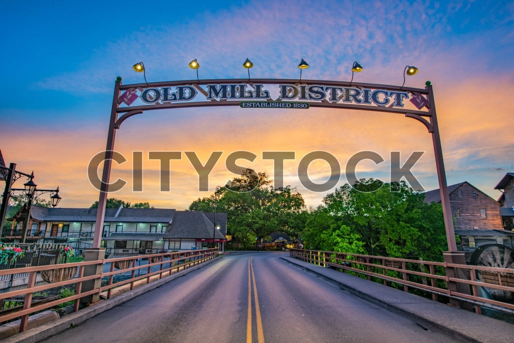 Dramatic sunset over historic Old Mill District Bridge in Pigeon Forge, TN