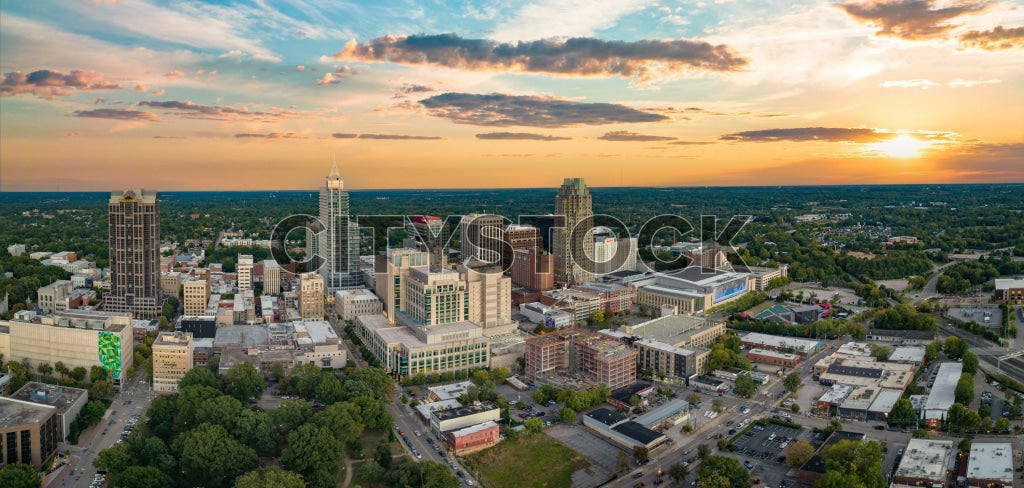 Aerial view of Raleigh NC skyline during sunset with vibrant hues