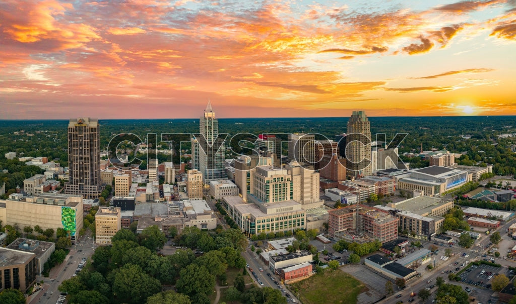 Aerial view of Raleigh, NC skyline during sunset, showcasing city buildings