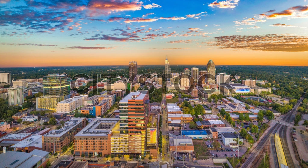 Aerial view of Raleigh NC at sunset, showcasing vibrant city colors