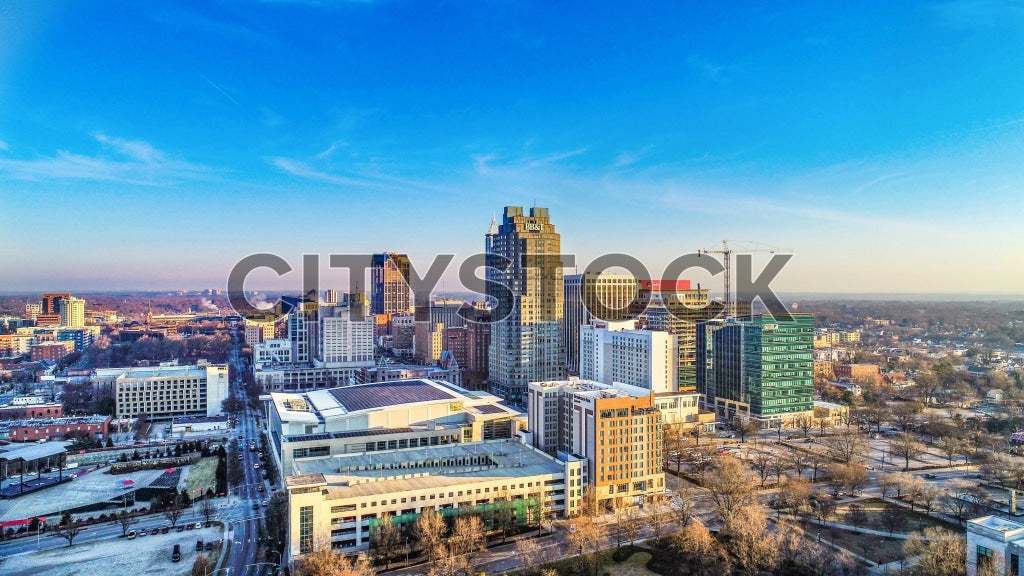 Aerial view of Raleigh, NC at sunrise showing cityscape and skyline