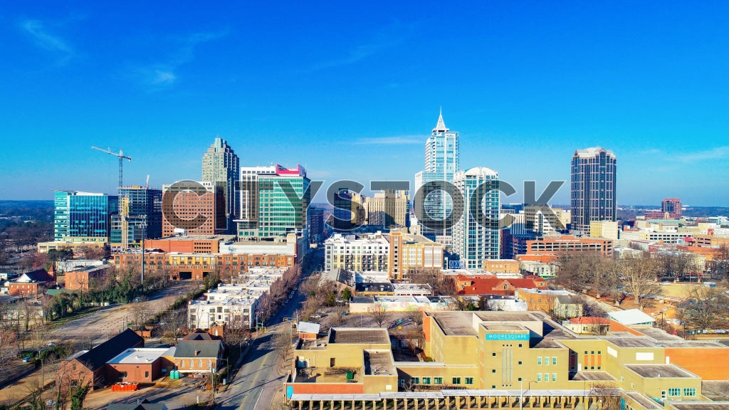 Aerial photograph of Raleigh skyline with blue sky