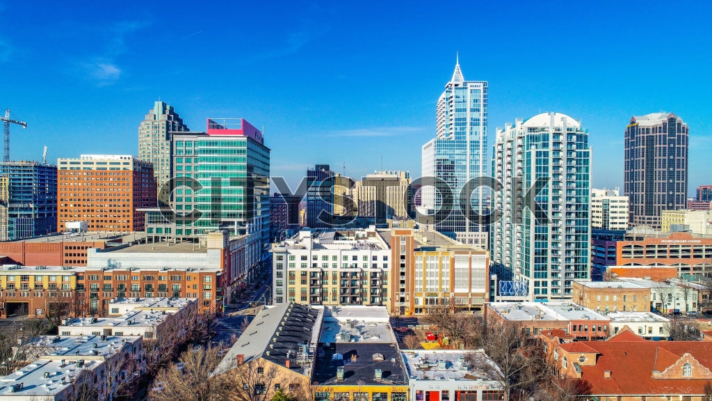 Aerial view of Raleigh NC downtown skyline under blue sky