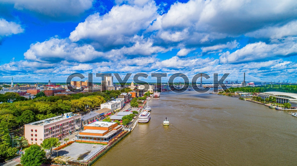 Aerial view of Savannah historic riverfront and skyline on a sunny day