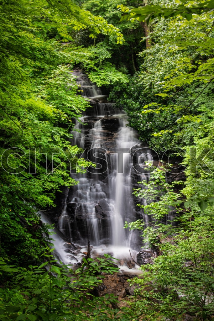 Soco Falls cascading through dense green foliage in North Carolina