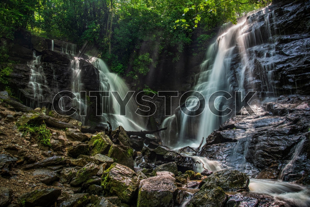 Lush green forest with dual cascading waterfalls at Soco Falls, North Carolina
