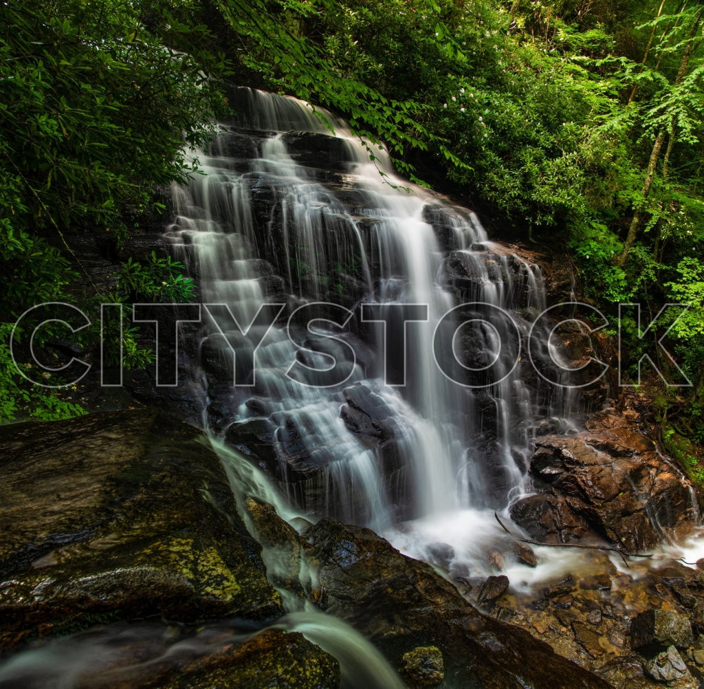 View of Soco Falls cascading through lush forestry in NC