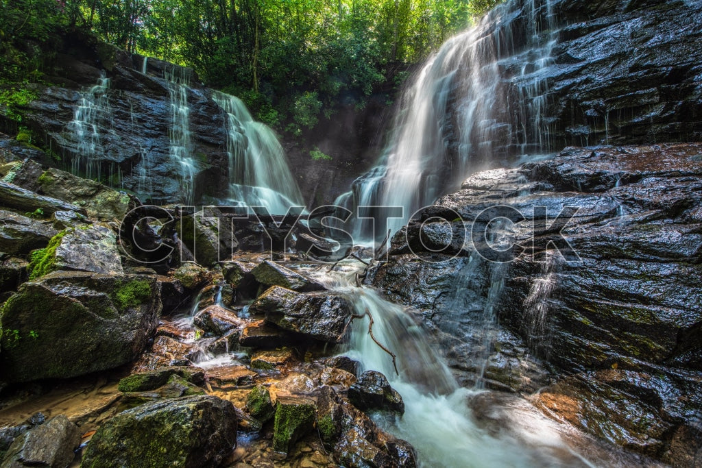 Serene cascade at Soco Falls surrounded by forest in Maggie Valley, NC