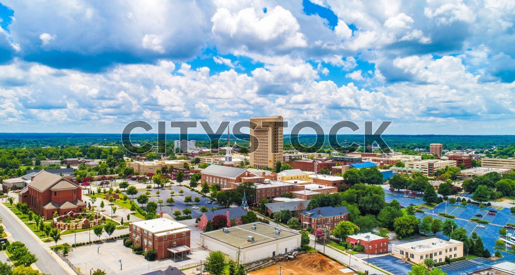 Aerial view of Spartanburg downtown blending urban and nature elements on a sunny day