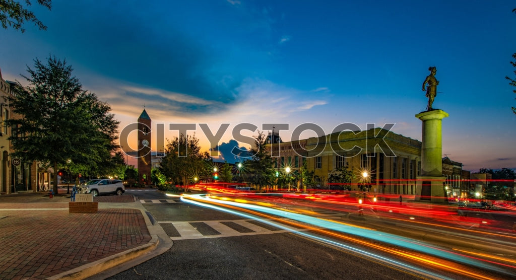 Vibrant urban twilight scene in Spartanburg with statue and light trails