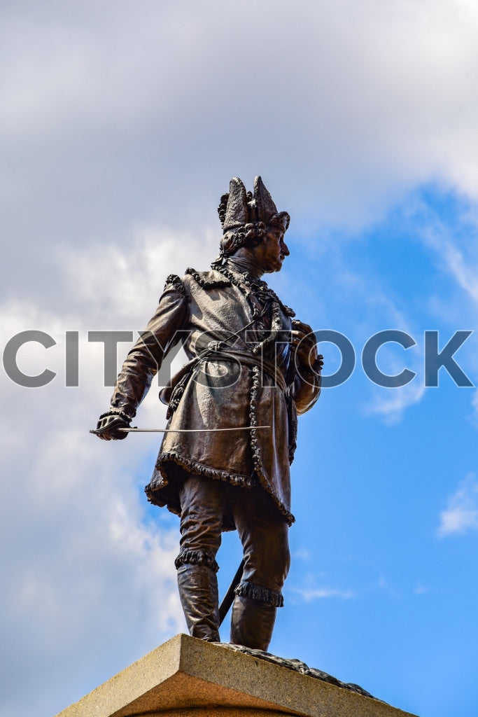 Historic statue in traditional attire against clear blue sky in Spartanburg, SC