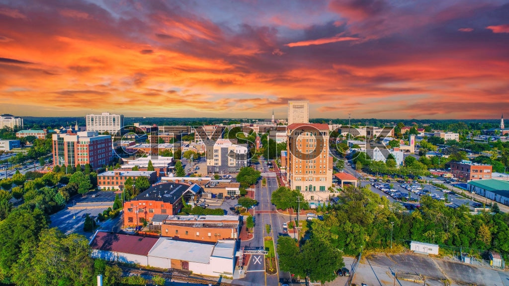 Aerial view of Spartanburg skyline during sunset with vibrant clouds