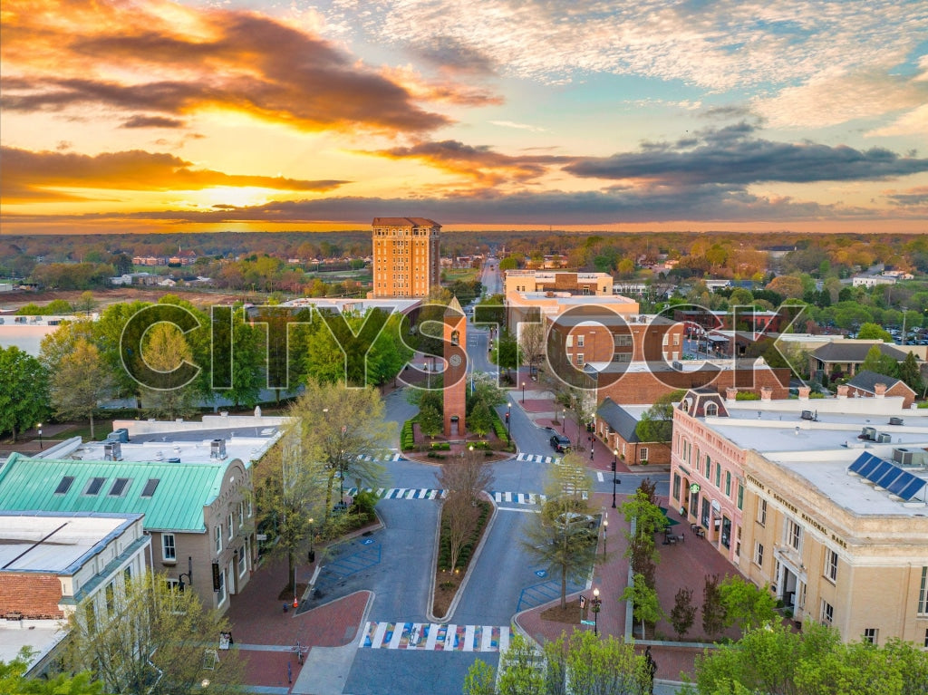 Aerial view of Spartanburg at sunrise with vibrant sunrise hues.