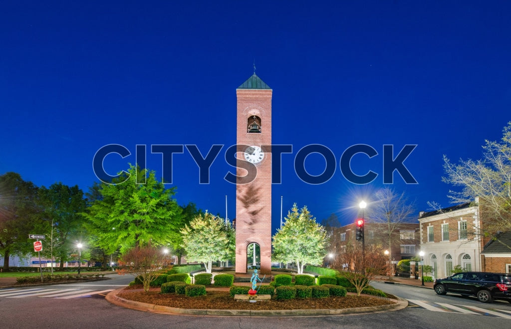 Twilight scene of Spartanburg Clock Tower surrounded by green urban park