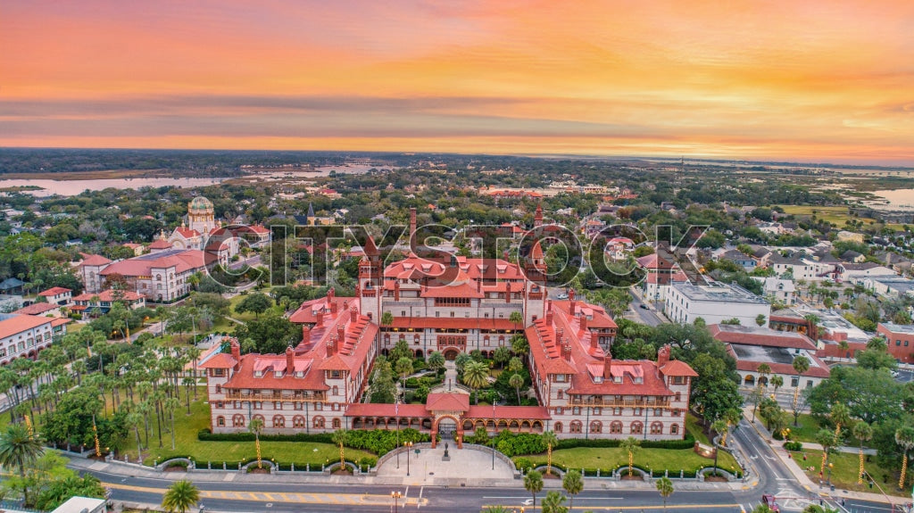 Aerial sunset view over St. Augustine, showcasing historical architecture and natural scenery.