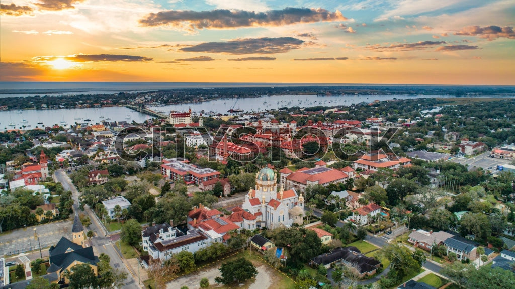 Aerial view of St Augustine, FL at sunset with historic landmarks