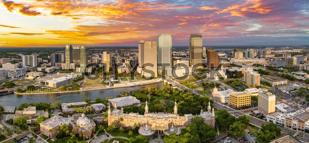Aerial view of Tampa skyline at sunset with vibrant clouds