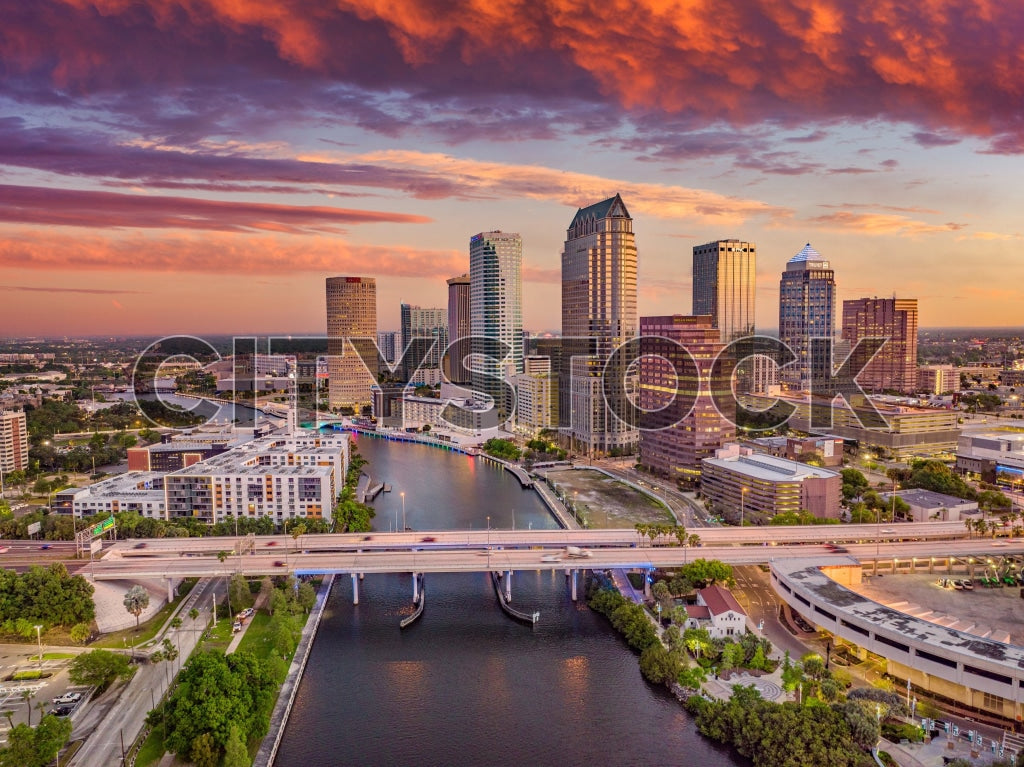 Aerial cityscape of Tampa Bay with skyscrapers at sunset