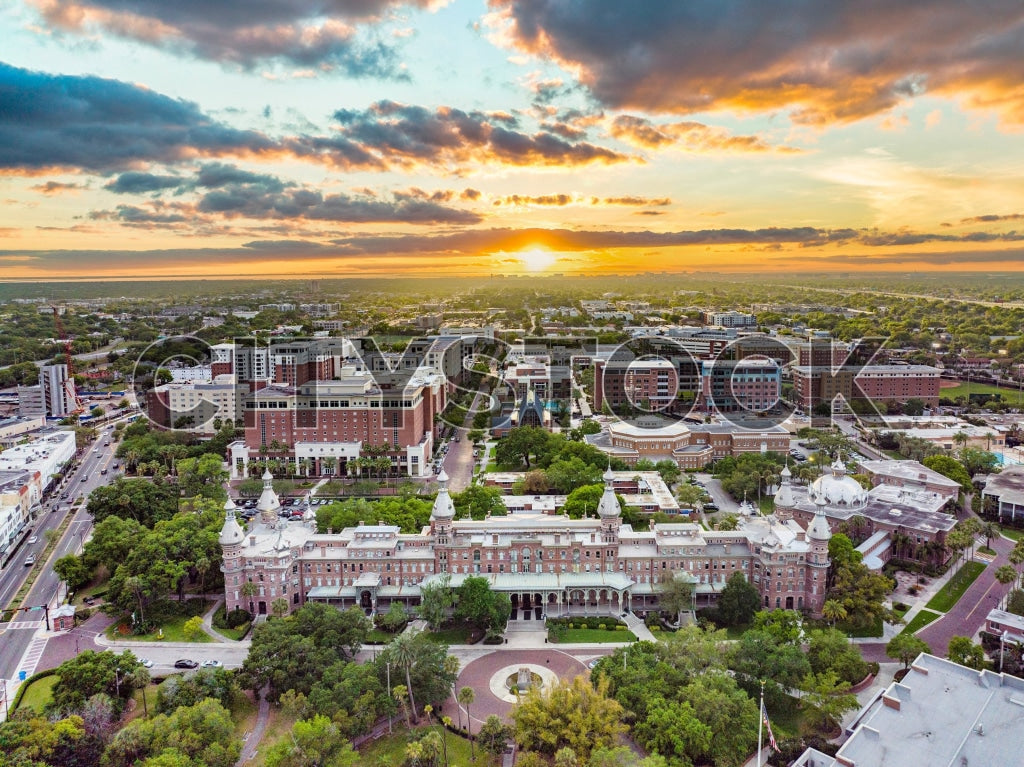 Aerial view of Tampa's skyline at sunset, featuring historic and modern architecture