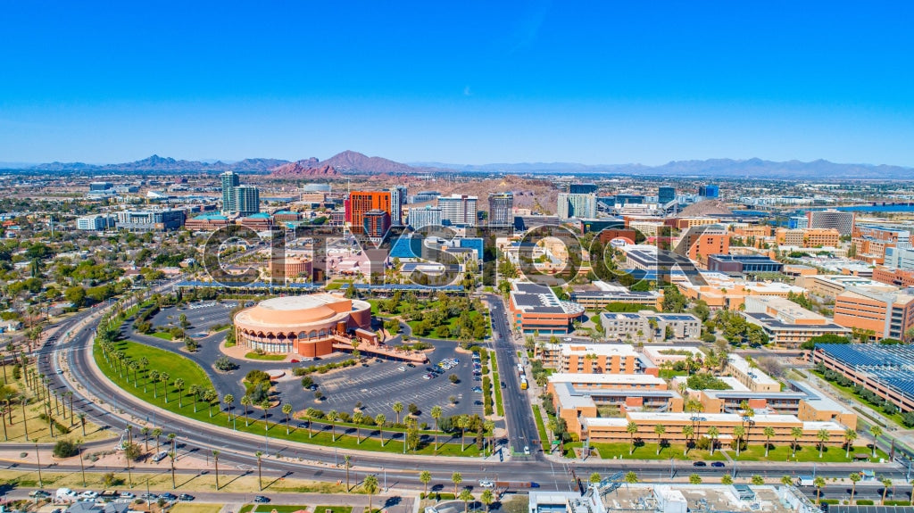 Aerial view of Tempe, Arizona with urban skyline and distant mountain
