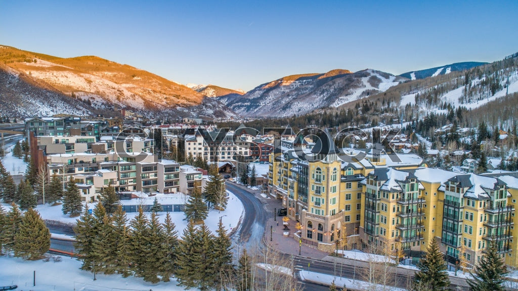 Aerial view of sunrise over snow-covered Vail Colorado during winter