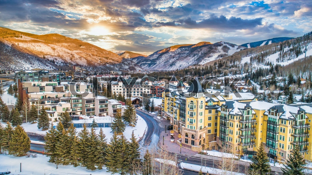 Aerial view of snowy Vail, Colorado at sunrise with ski slopes
