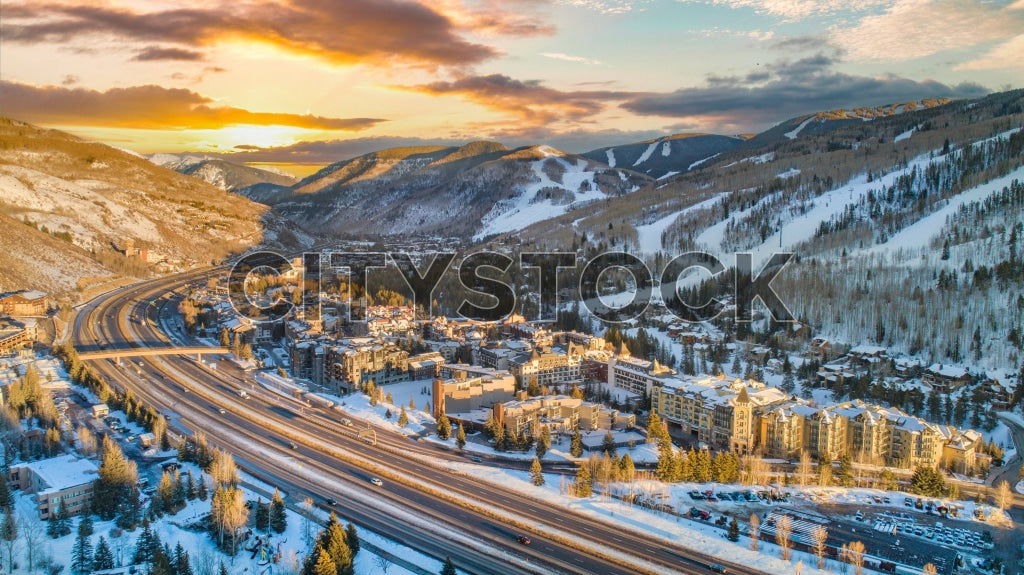 Aerial view of Vail, Colorado during sunrise with snow-covered mountains